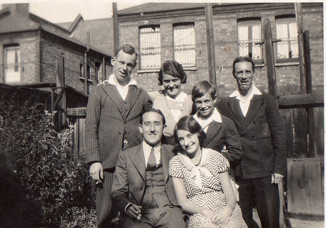 A black and white vintage photograph of a family from the early decades of the 20th century