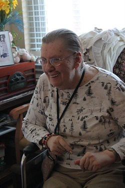 Diane Olsen Grins At The Arriving Flowers