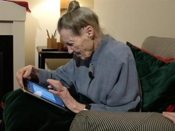 A senior woman using her iPad