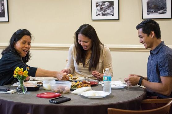 A family enjoys a dinner in the dining facility