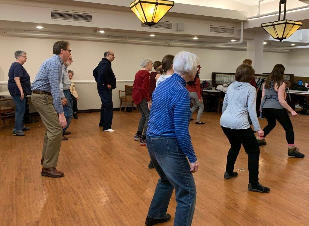 A group of seniors participating in an exercise class.